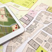 Buildings Permit concept with imaginary cadastral on digital tablet - building activity and construction industry with General Urban Plan